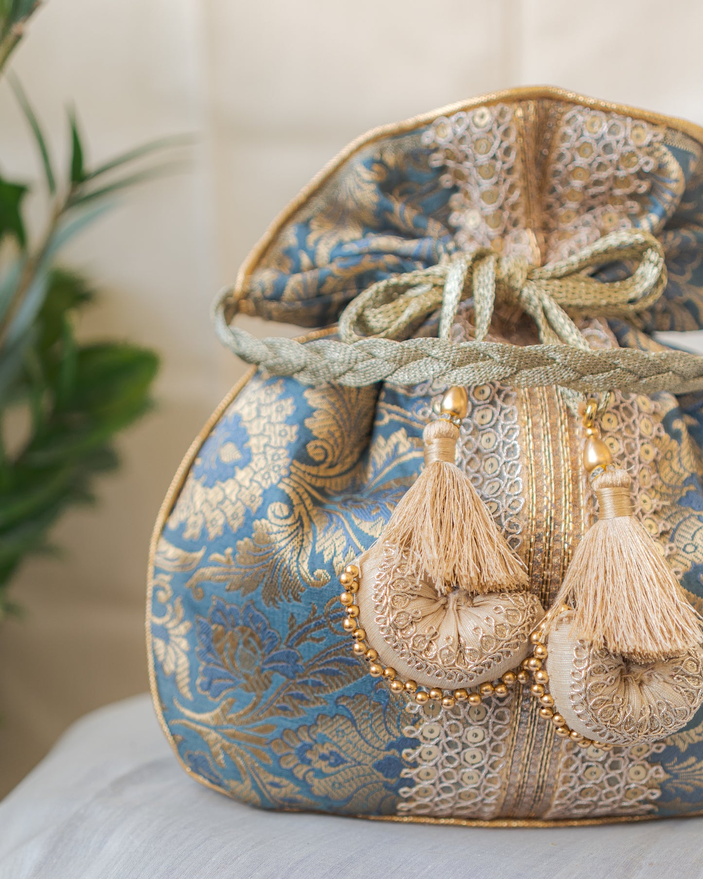 Grey & Golden Banarasi Potli With Broad Lace