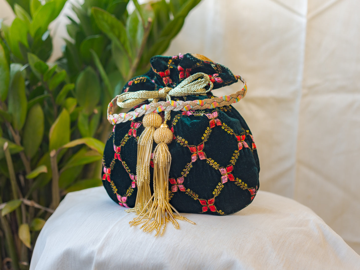 Bottle Green Velvet Potli With Golden Glass Tassels