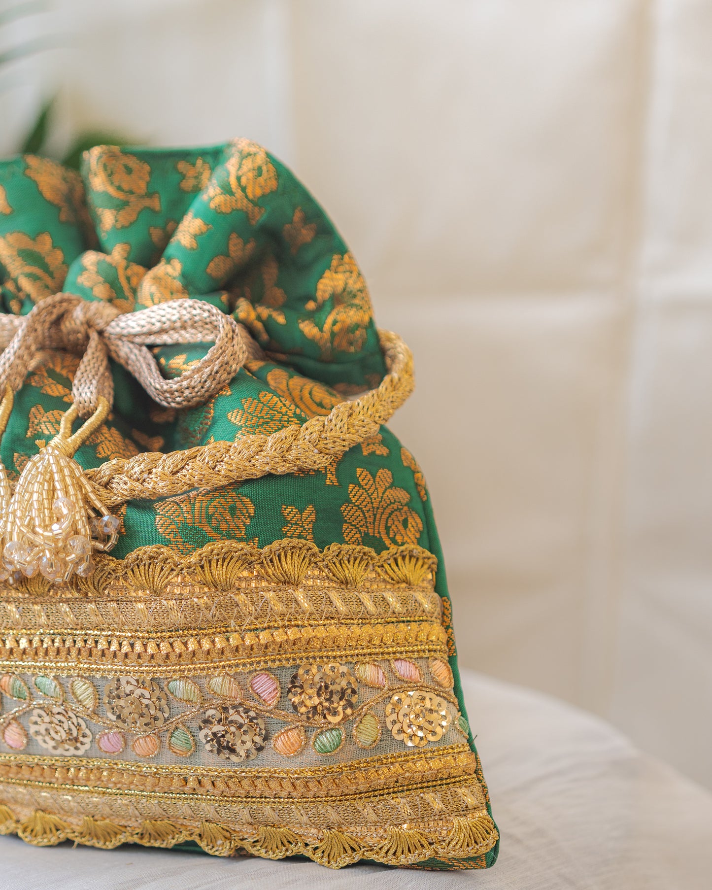 Green & Golden Banarasi Potli With Broad Lace