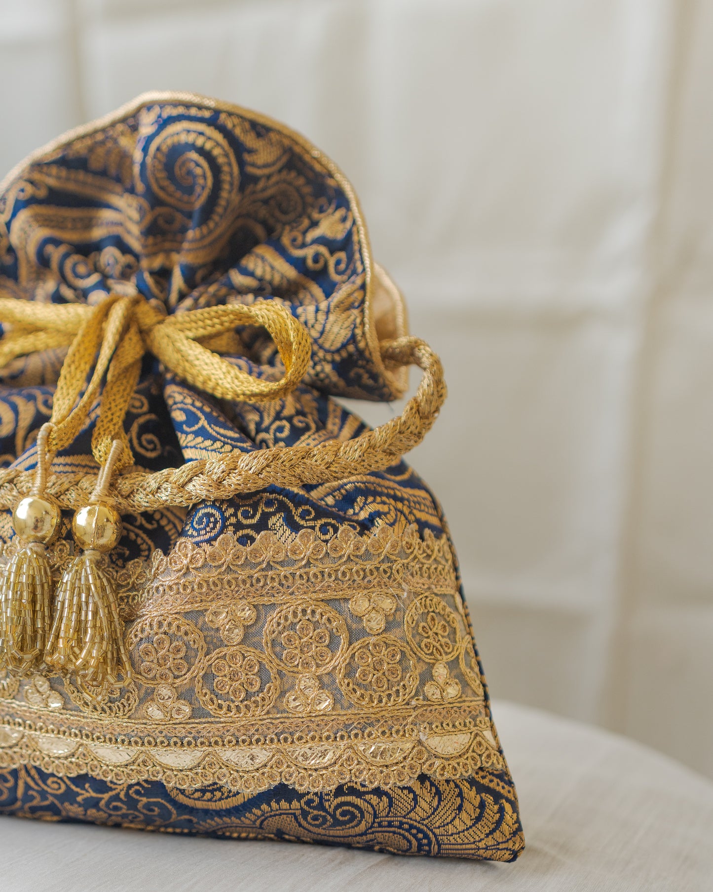 Navy Blue & Golden Banarasi Potli With Golden Broad Lace