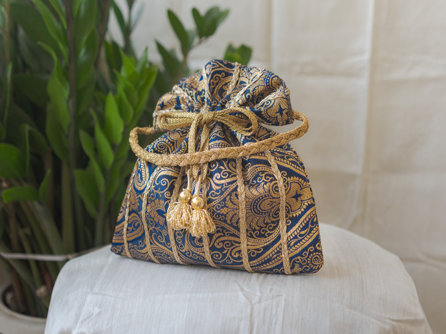 Navy Blue & Golden Banarasi Potli With Glass Tassels