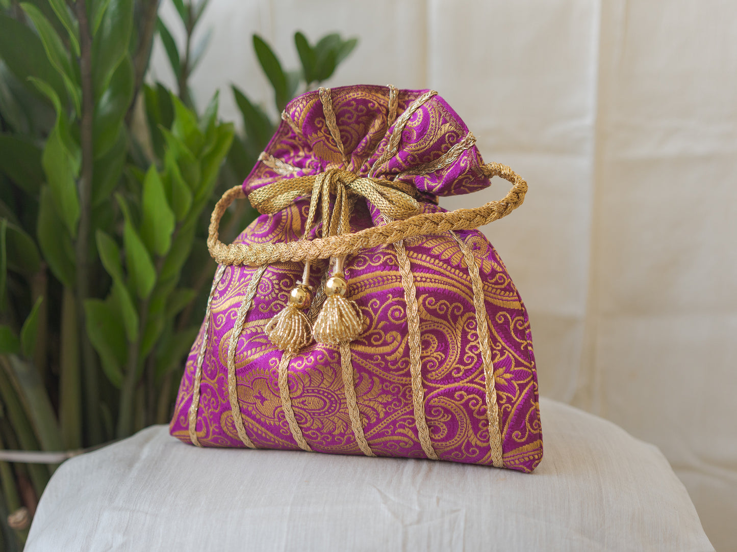 Purple & Golden Banarasi Potli With Glass Tassels