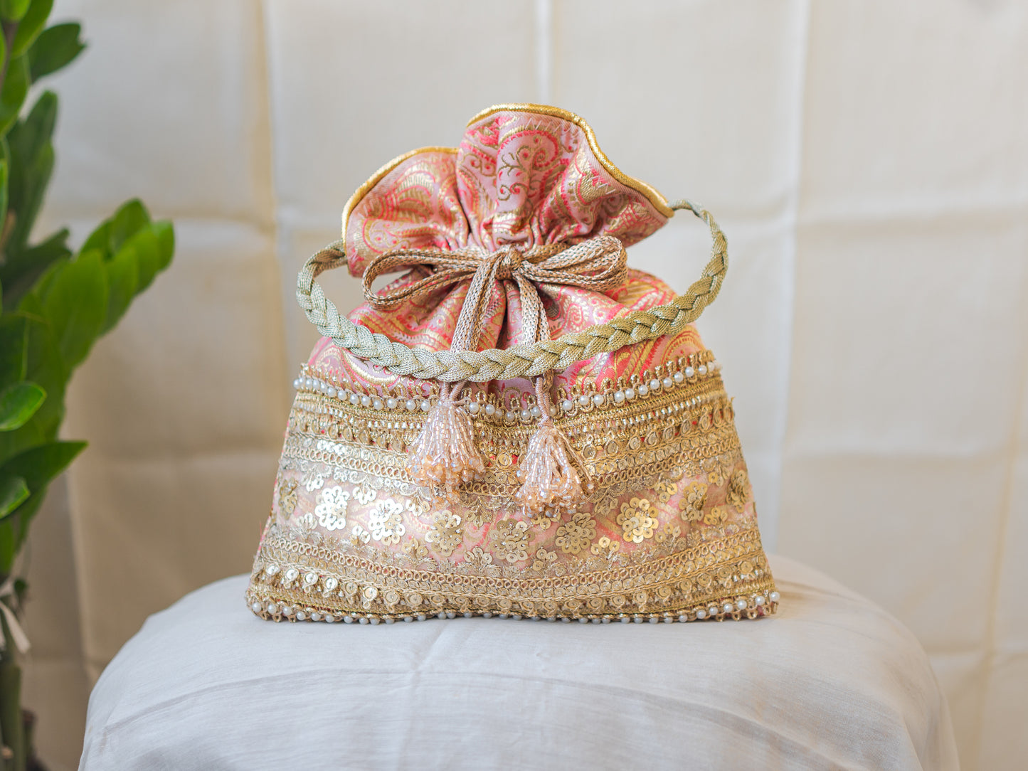 Peach Pink & Golden Banarasi Potli With Broad Sequin Pearl Lacework