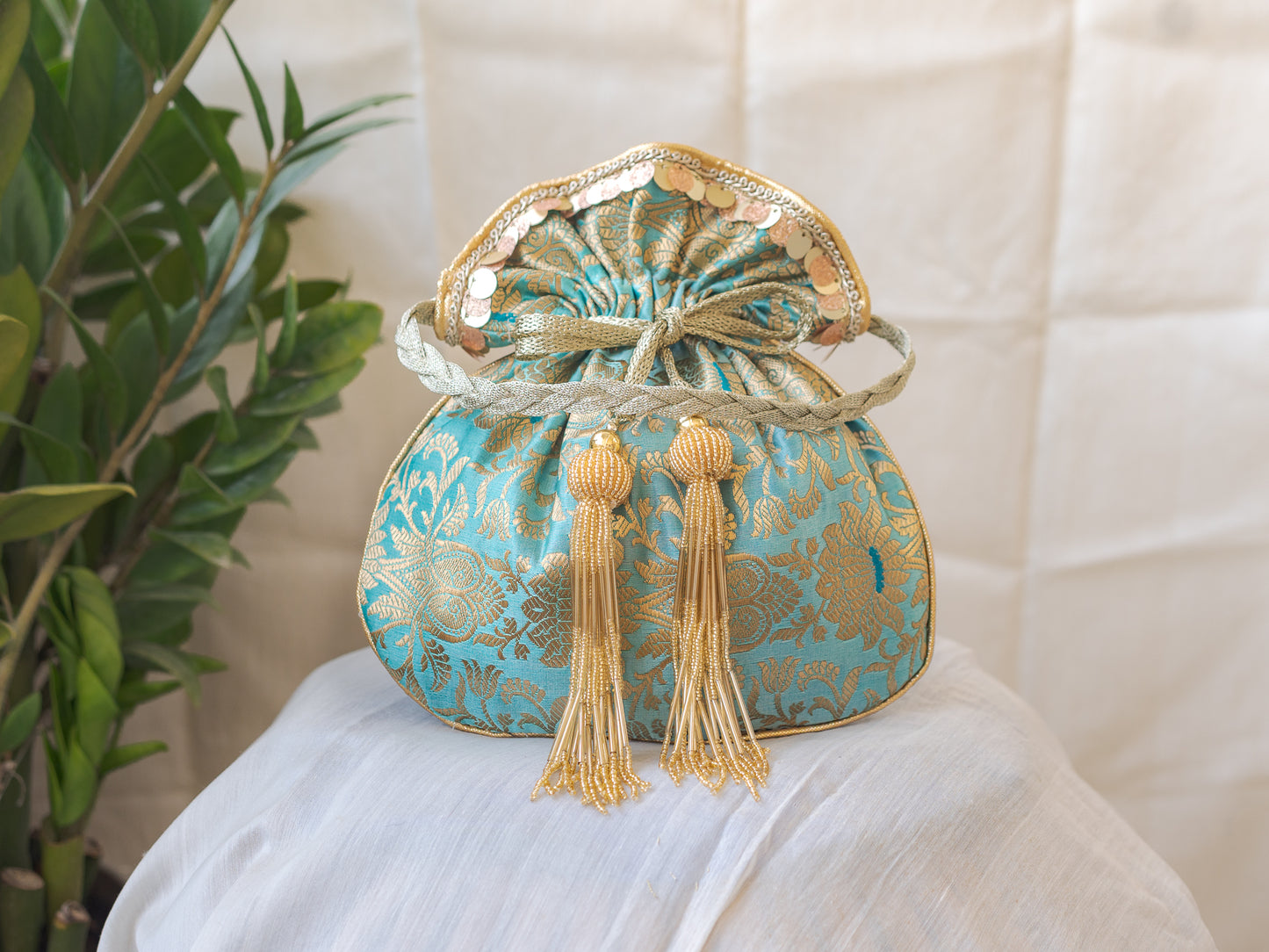 Sage Green & Golden Banarasi Potli With Glass Tassels