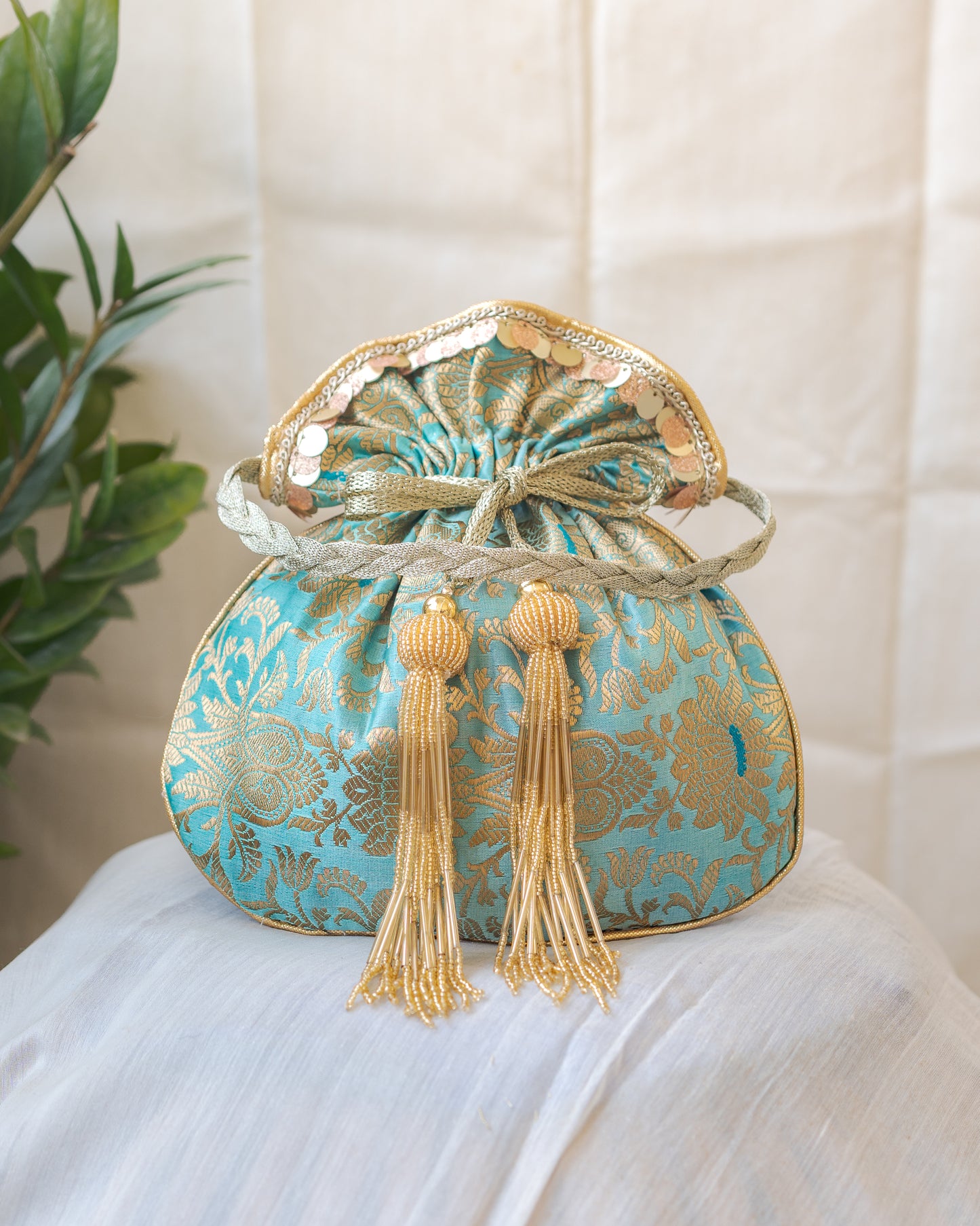 Sage Green & Golden Banarasi Potli With Glass Tassels