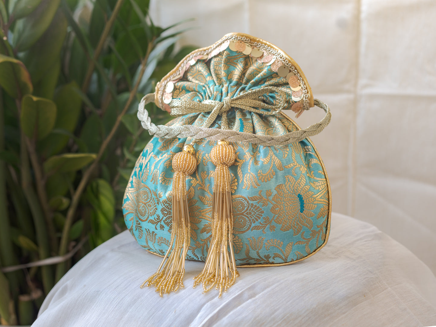 Sage Green & Golden Banarasi Potli With Glass Tassels