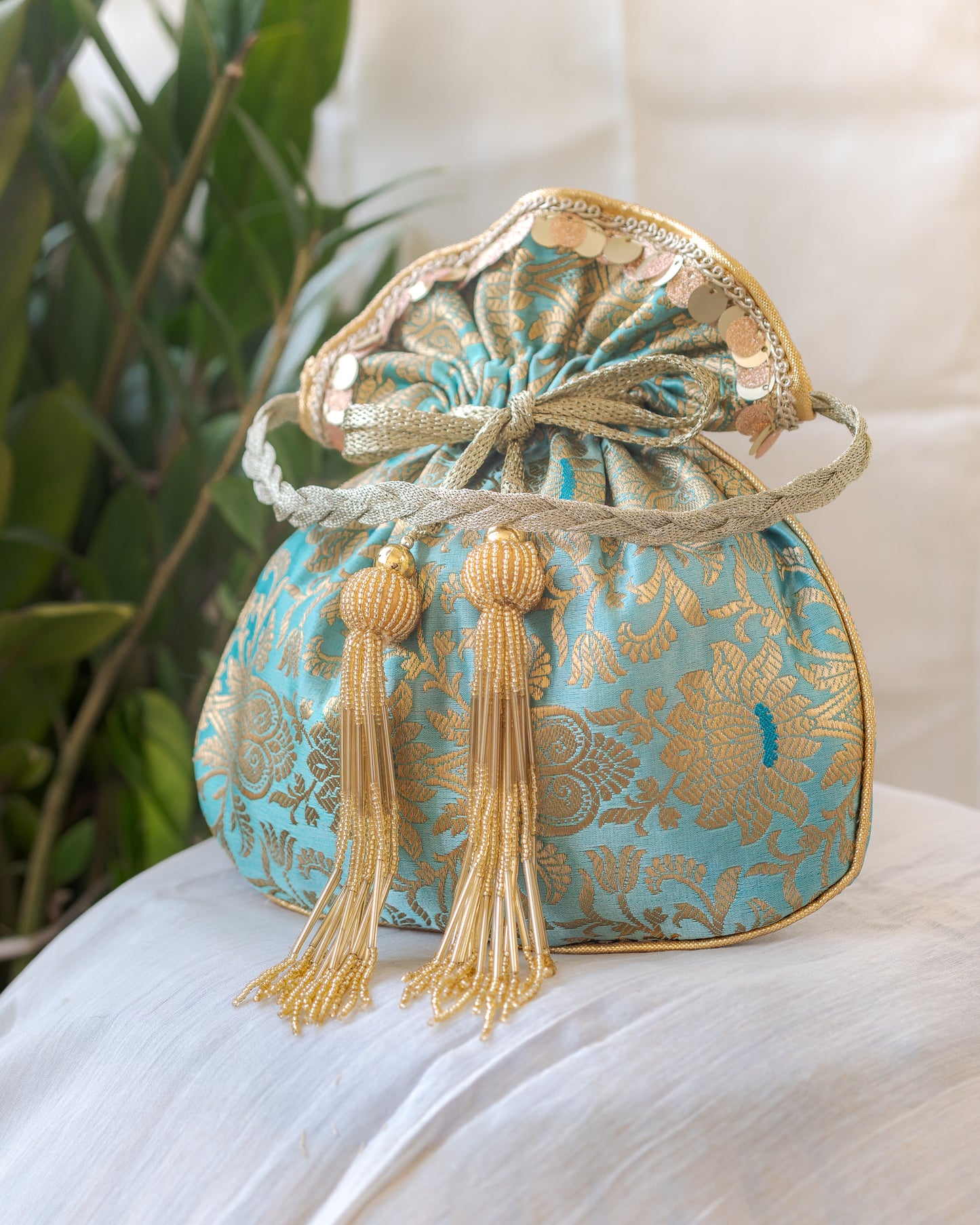 Sage Green & Golden Banarasi Potli With Glass Tassels