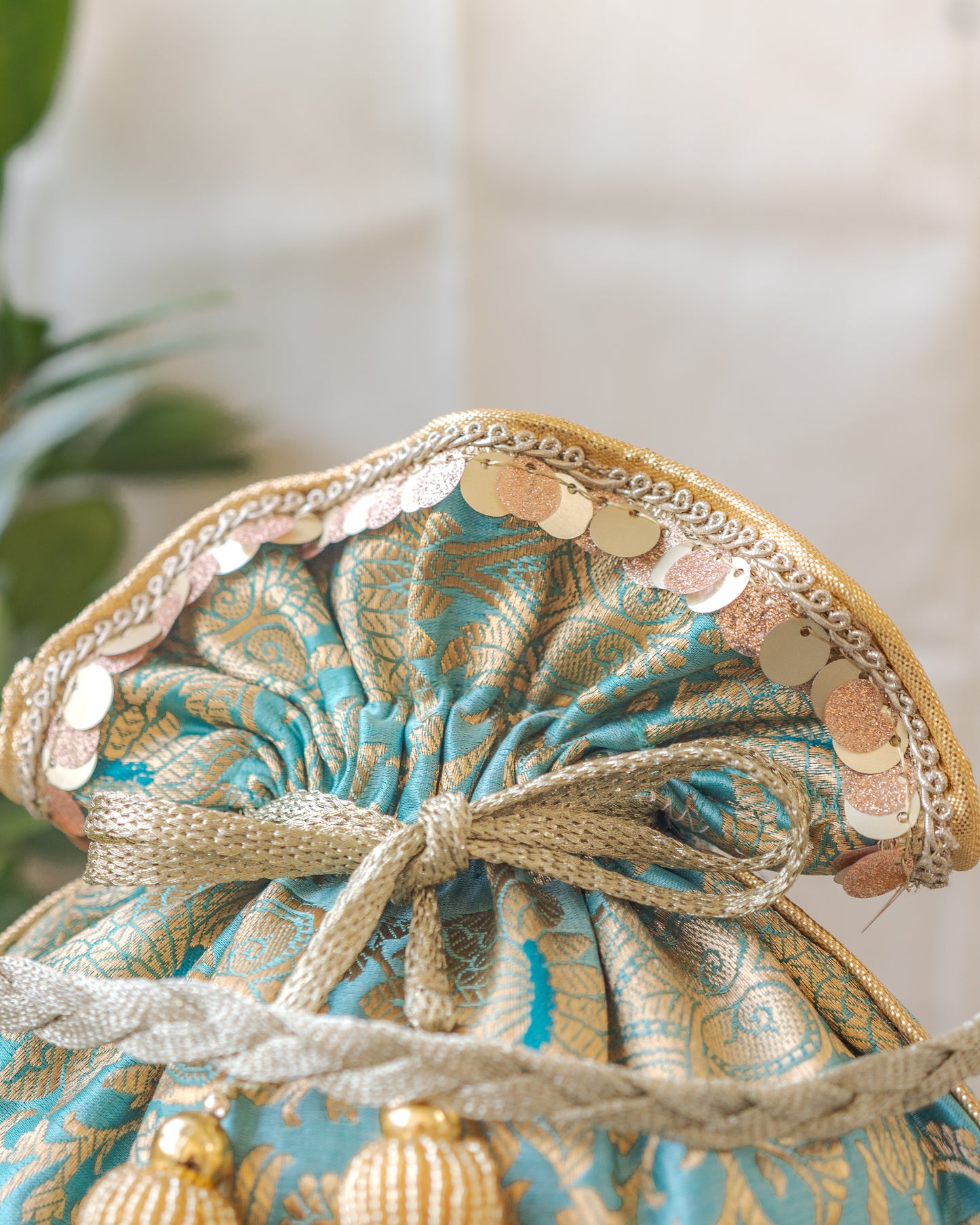 Sage Green & Golden Banarasi Potli With Glass Tassels
