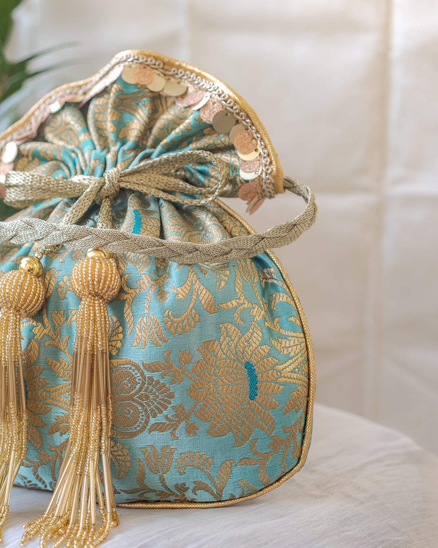 Sage Green & Golden Banarasi Potli With Glass Tassels