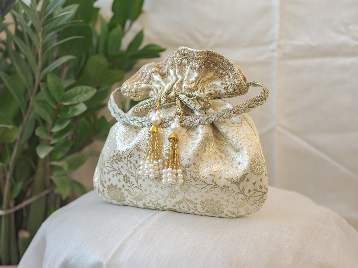 Off White and Golden Banarasi Potli With Pearl Tassels