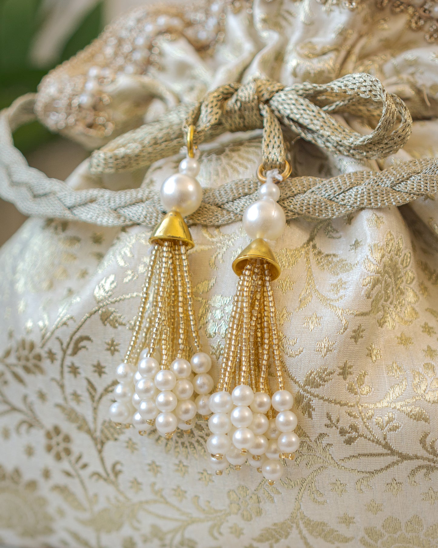 Off White and Golden Banarasi Potli With Pearl Tassels