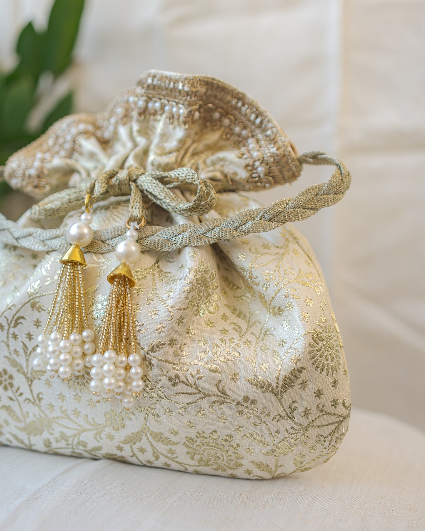 Off White and Golden Banarasi Potli With Pearl Tassels