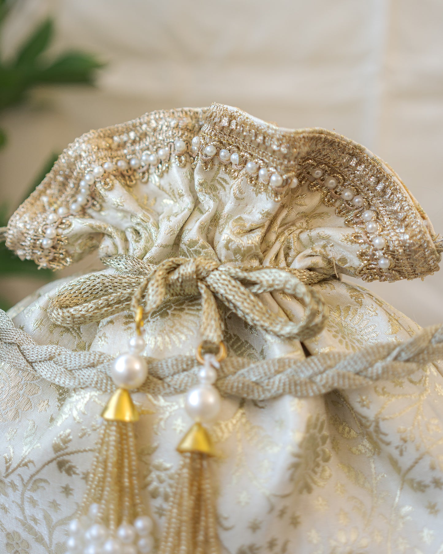 Off White and Golden Banarasi Potli With Pearl Tassels