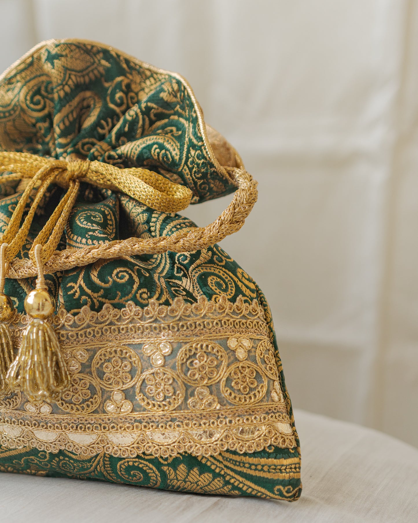 Bottle Green & Golden Banarasi Potli With Golden Broad Lace