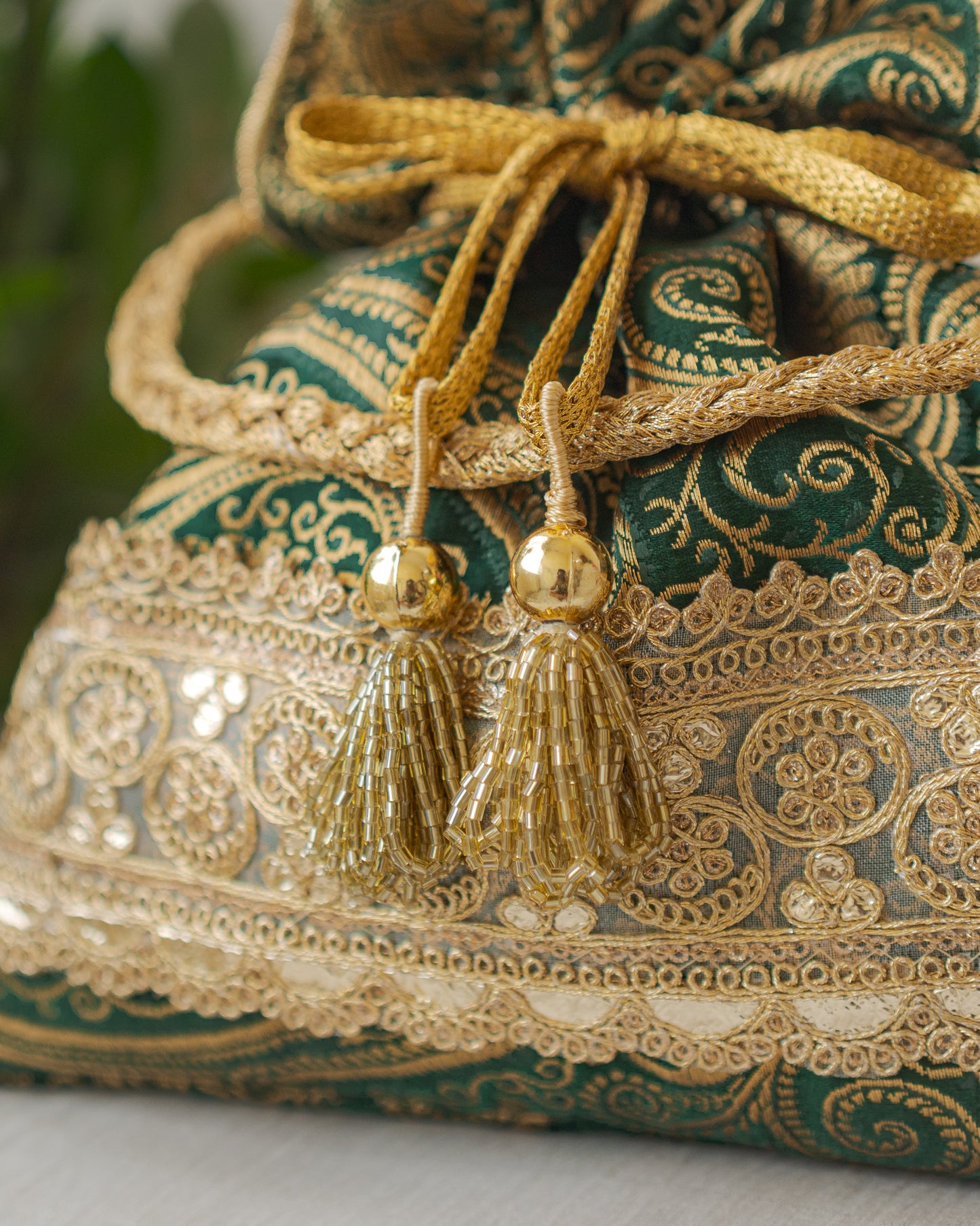 Bottle Green & Golden Banarasi Potli With Golden Broad Lace
