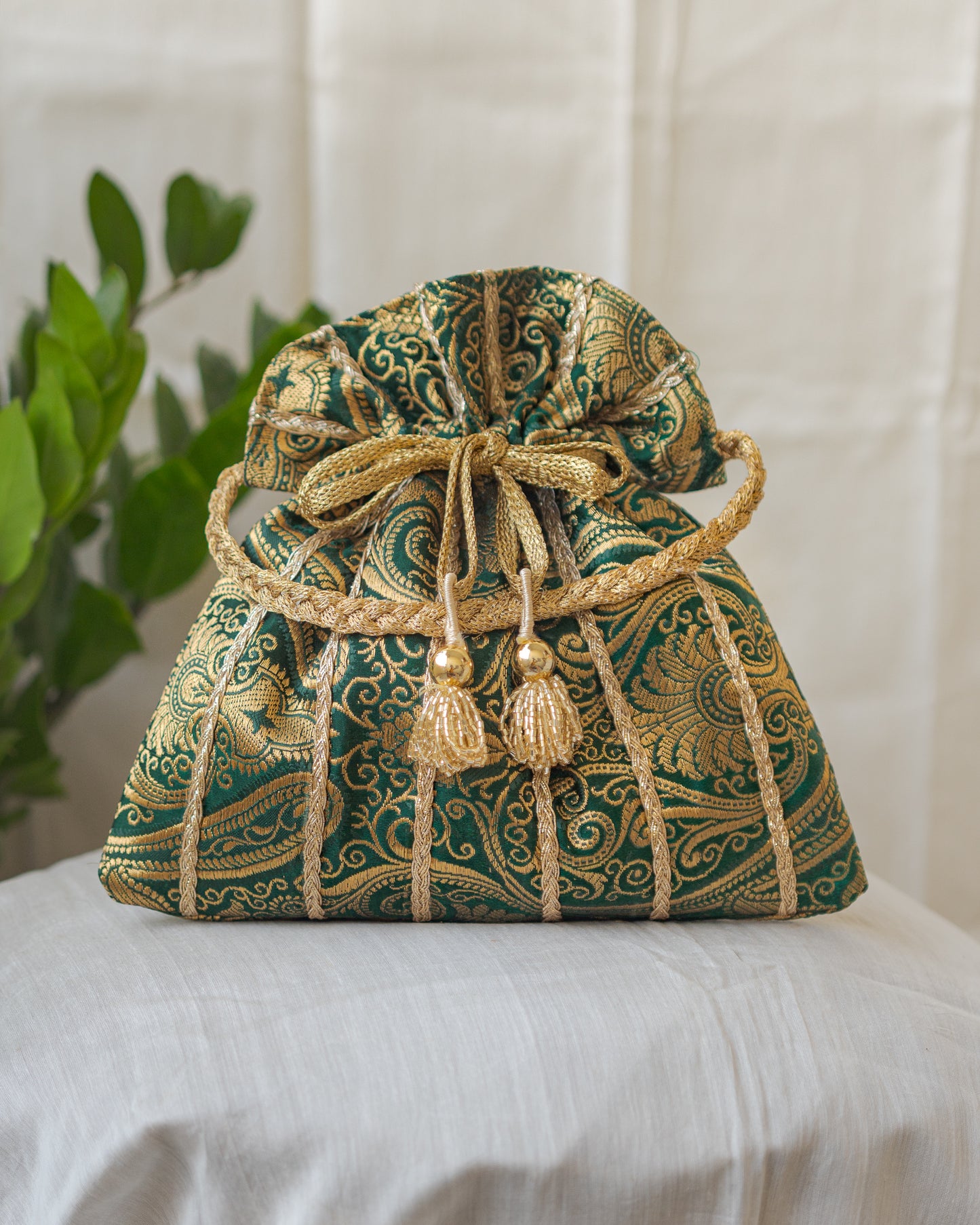 Bottle Green & Golden Banarasi Potli With Glass Tassels