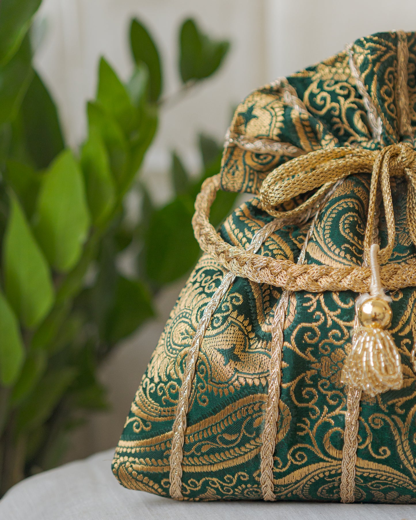 Bottle Green & Golden Banarasi Potli With Glass Tassels