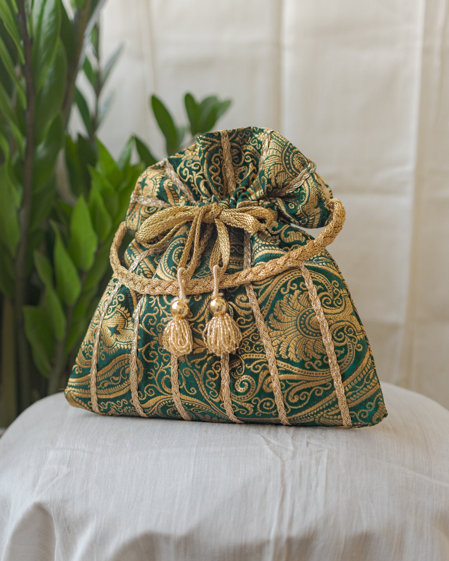 Bottle Green & Golden Banarasi Potli With Glass Tassels