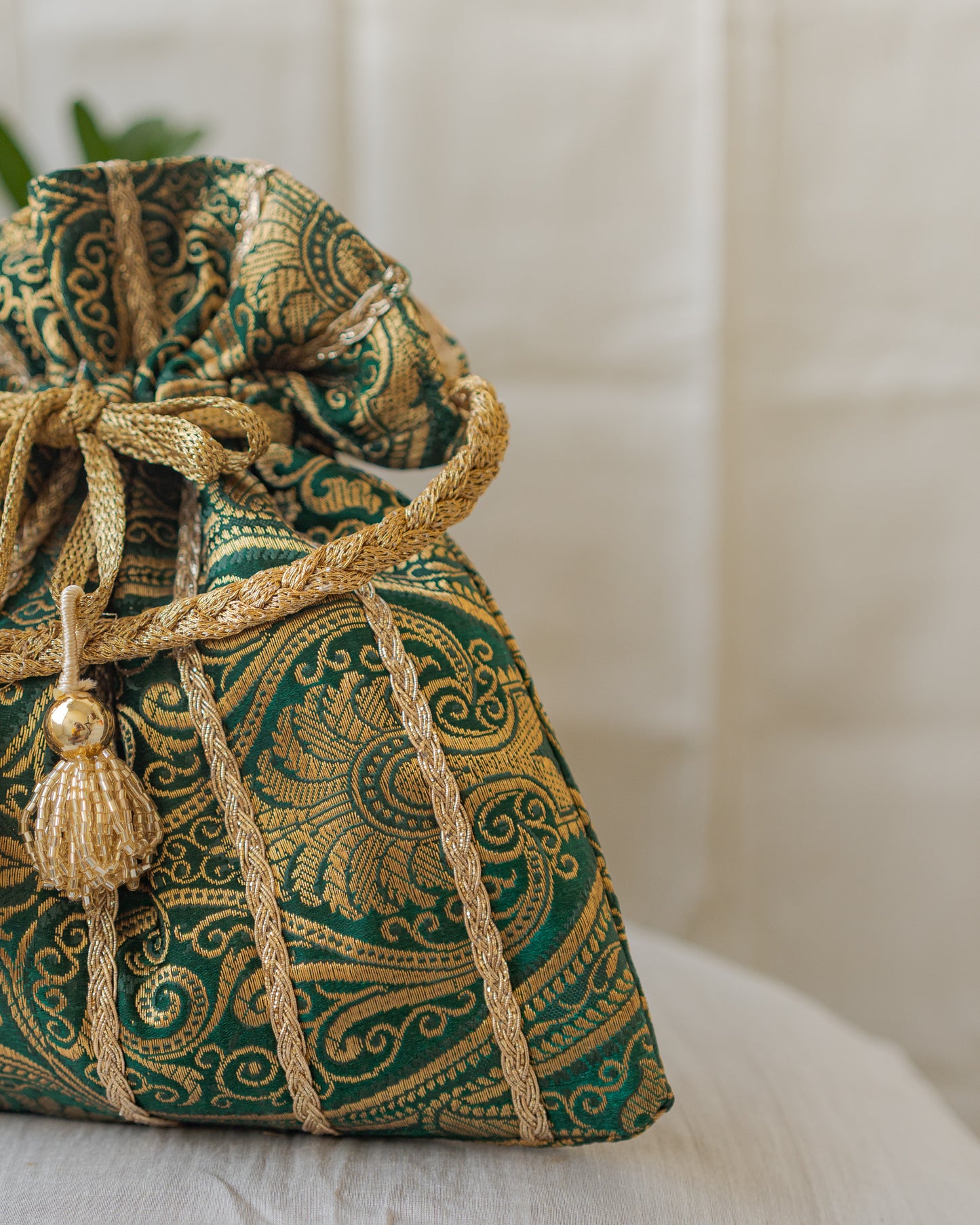 Bottle Green & Golden Banarasi Potli With Glass Tassels