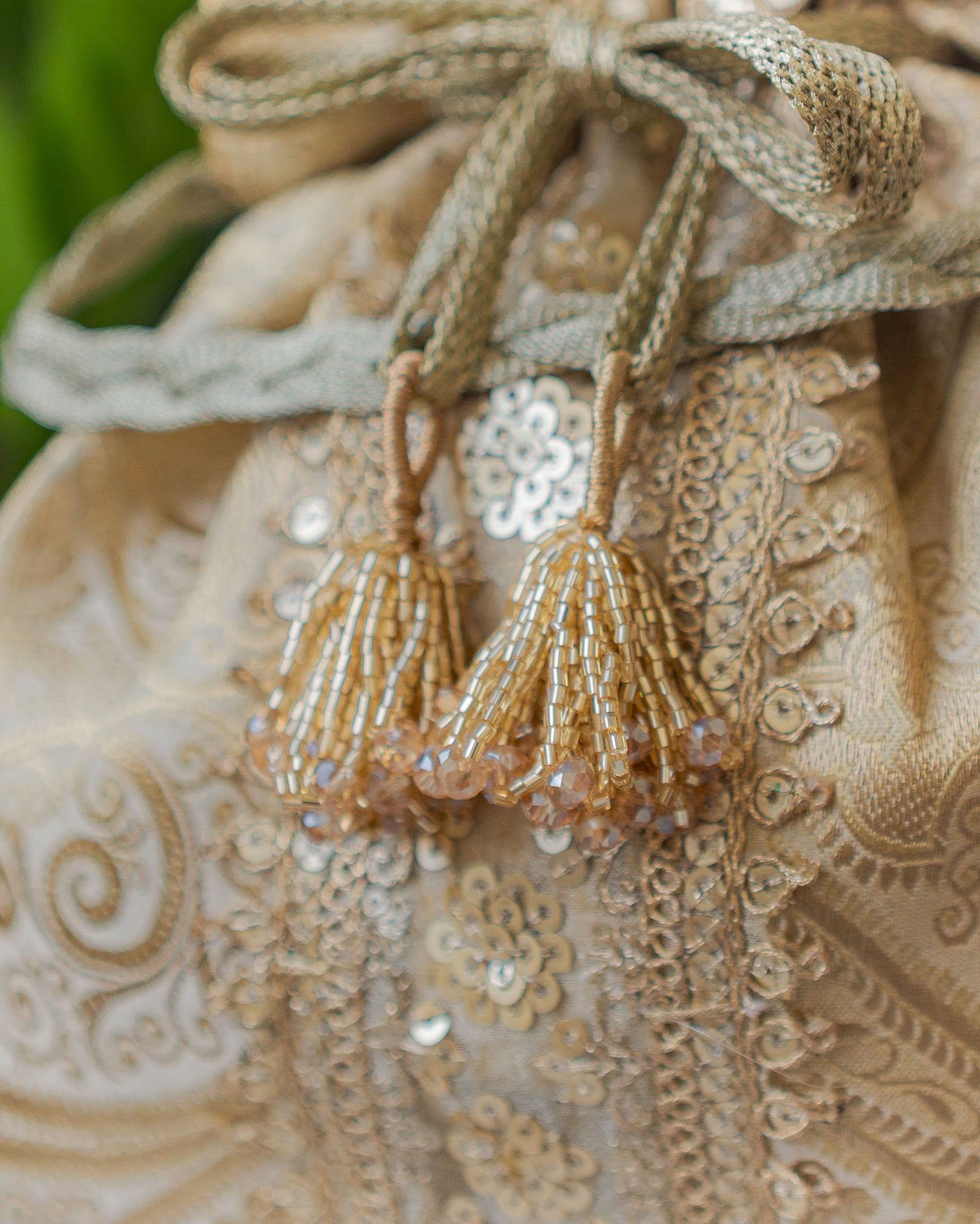Chikoo Golden Banarasi Potli With Sequin Lace & Glass Tassels