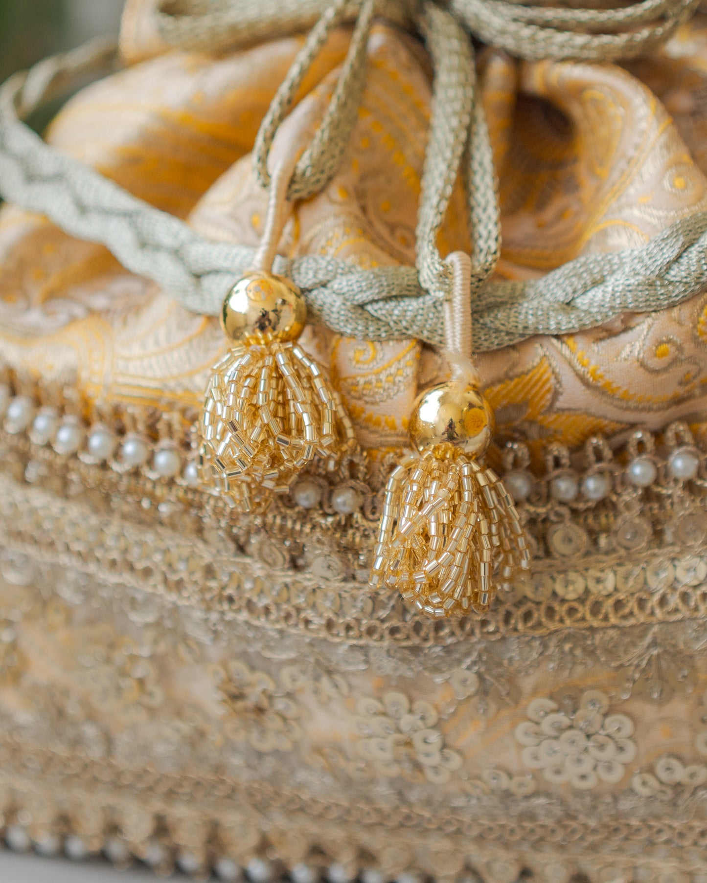 Light Yellow & Golden Banarasi Potli With Broad Sequin Pearl Lacework
