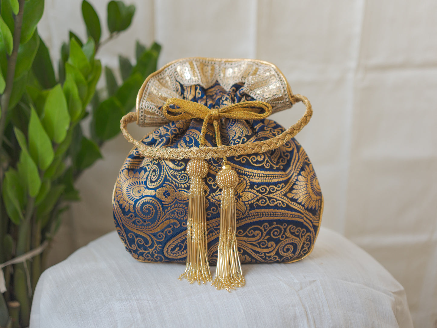 Navy Blue & Golden Banarasi Potli With Glass Tassels