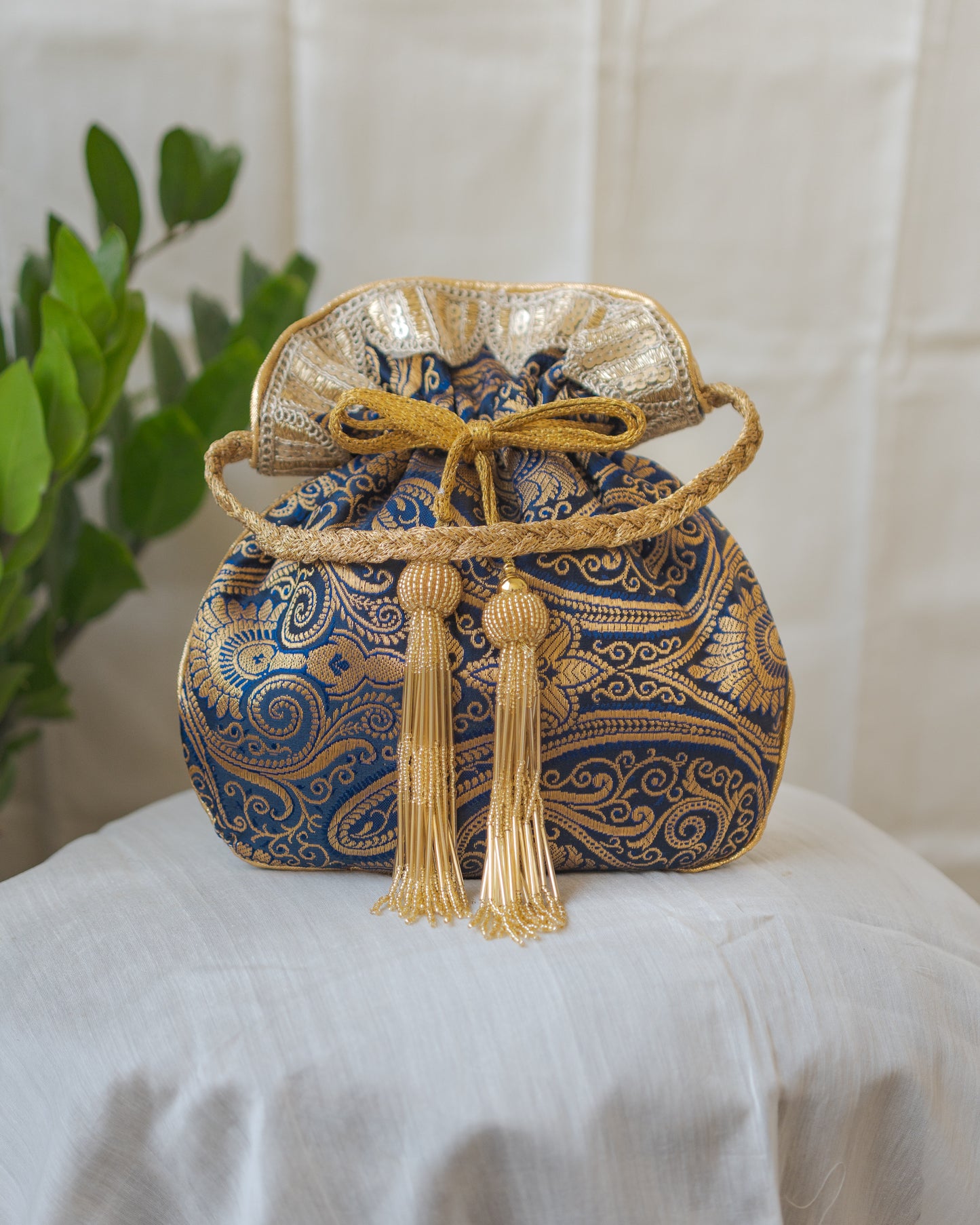 Navy Blue & Golden Banarasi Potli With Glass Tassels