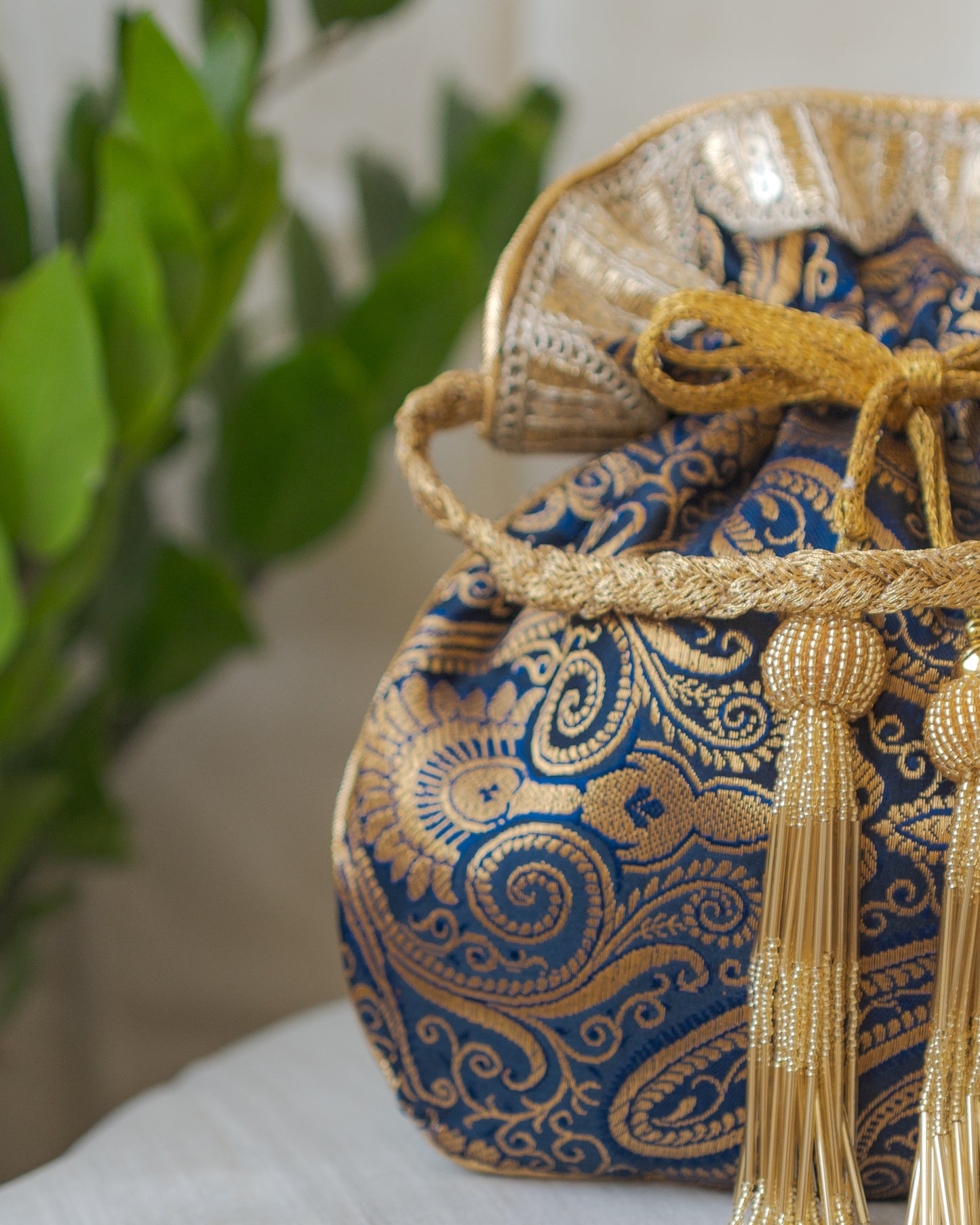 Navy Blue & Golden Banarasi Potli With Glass Tassels