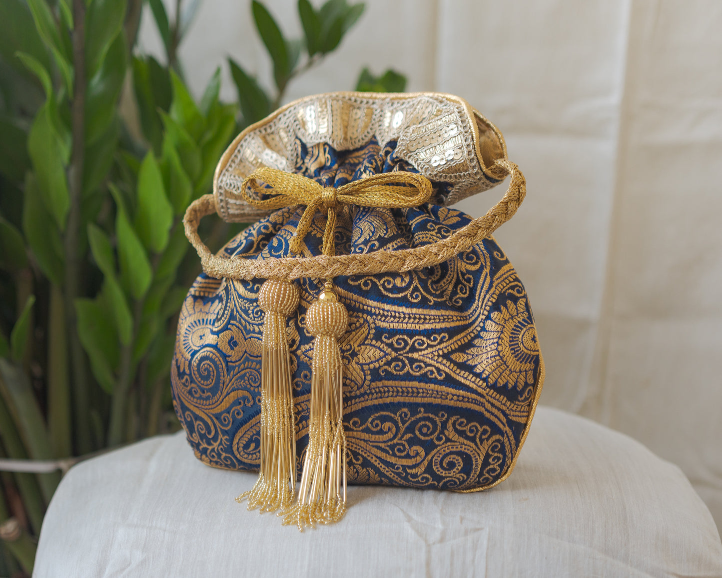 Navy Blue & Golden Banarasi Potli With Glass Tassels
