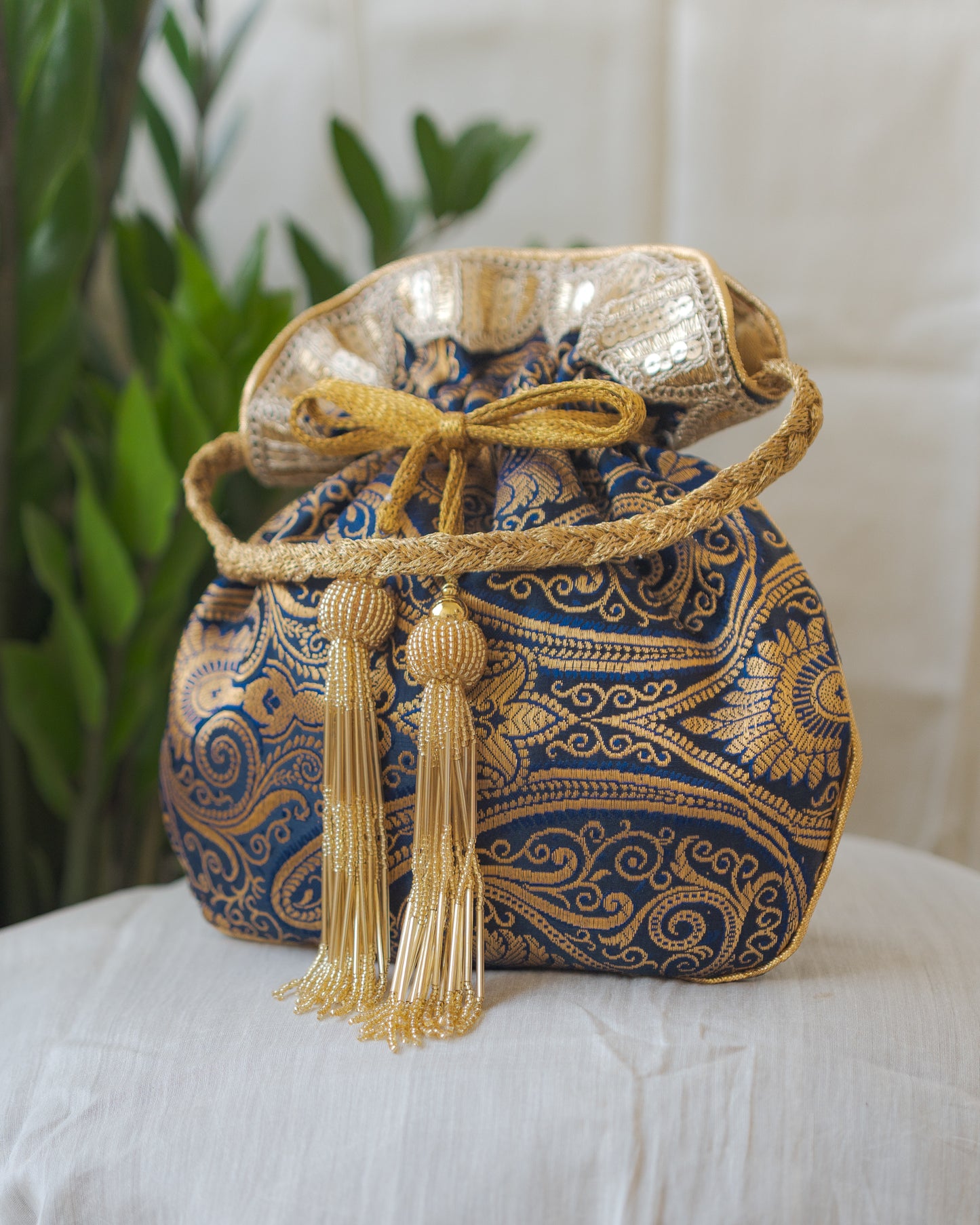 Navy Blue & Golden Banarasi Potli With Glass Tassels