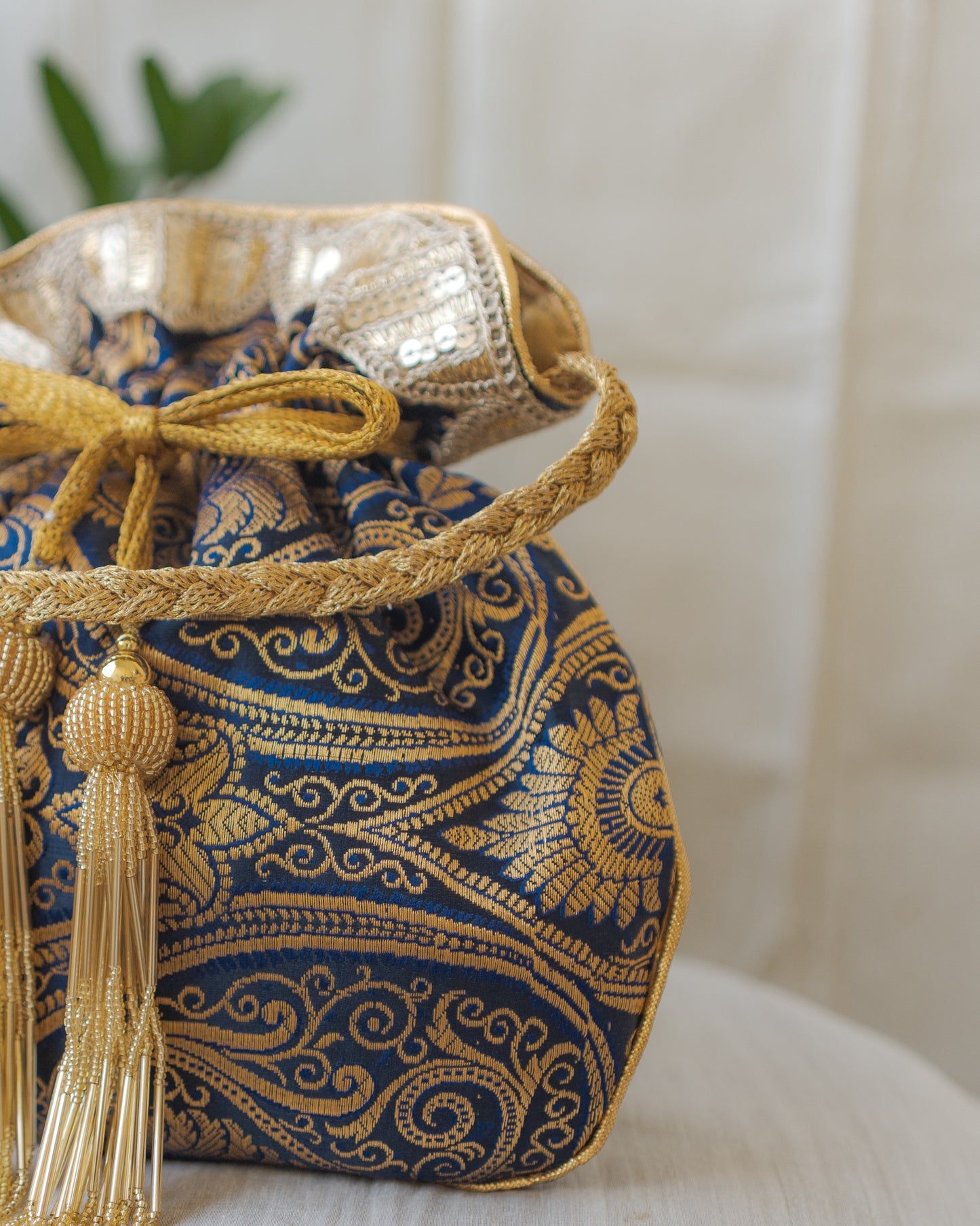 Navy Blue & Golden Banarasi Potli With Glass Tassels
