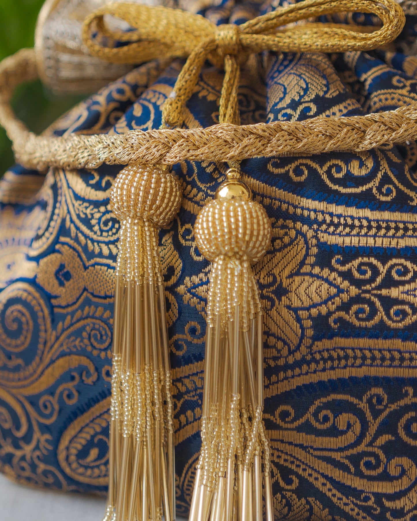 Navy Blue & Golden Banarasi Potli With Glass Tassels