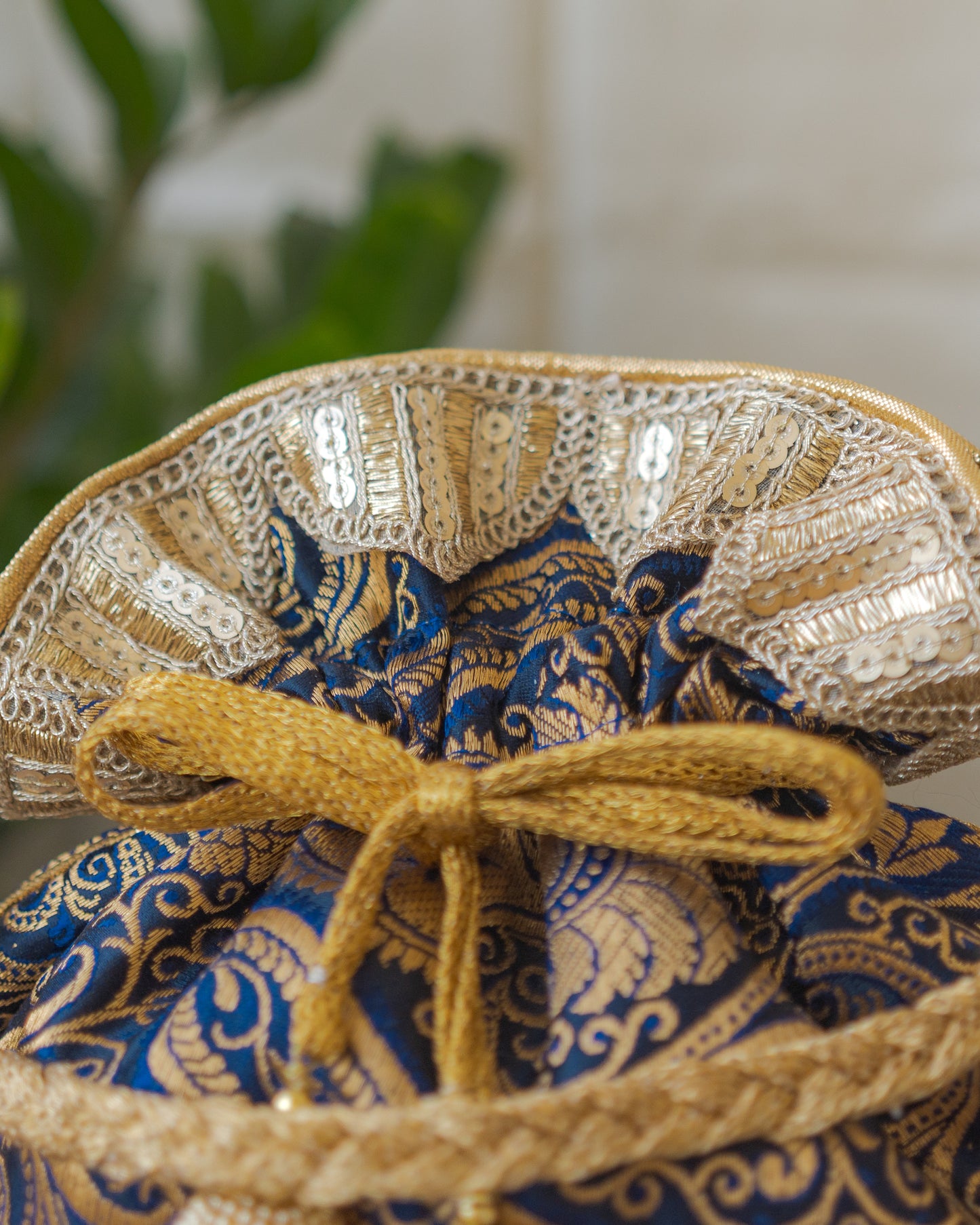 Navy Blue & Golden Banarasi Potli With Glass Tassels
