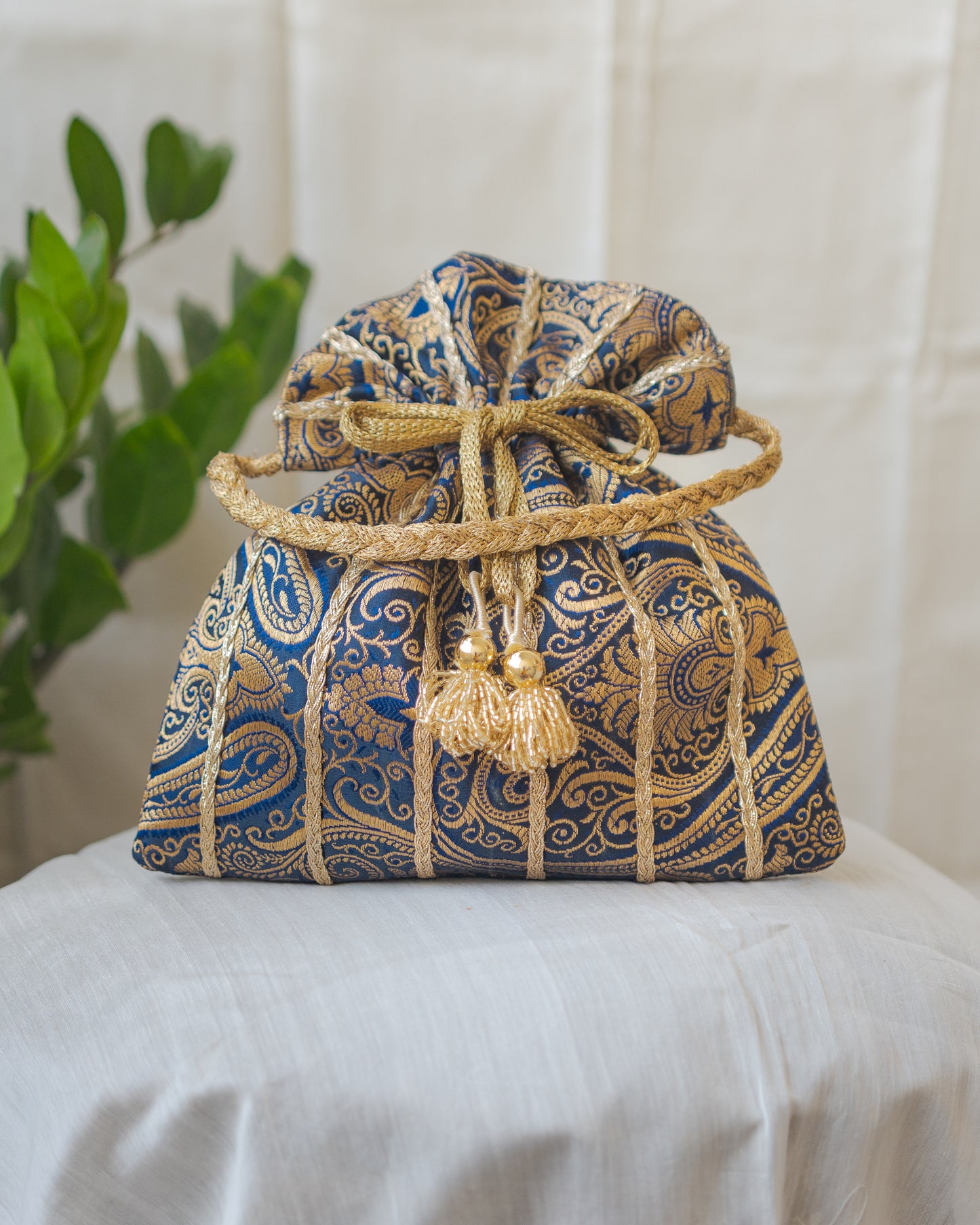 Navy Blue & Golden Banarasi Potli With Glass Tassels