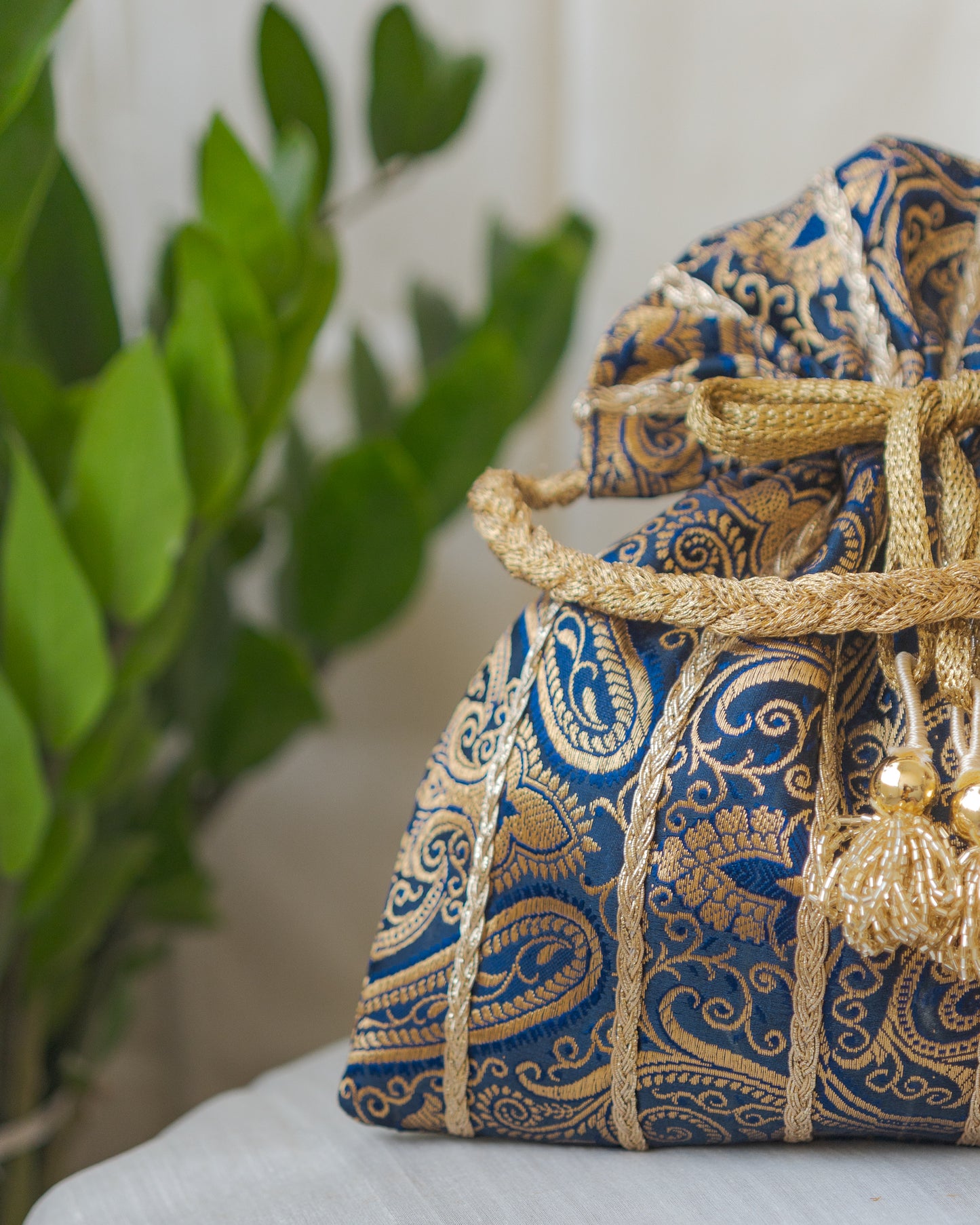 Navy Blue & Golden Banarasi Potli With Glass Tassels