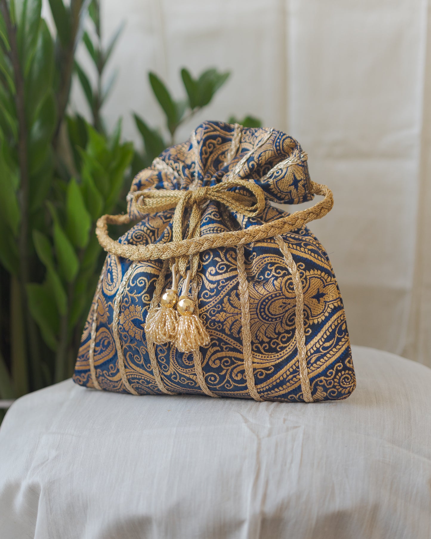 Navy Blue & Golden Banarasi Potli With Glass Tassels