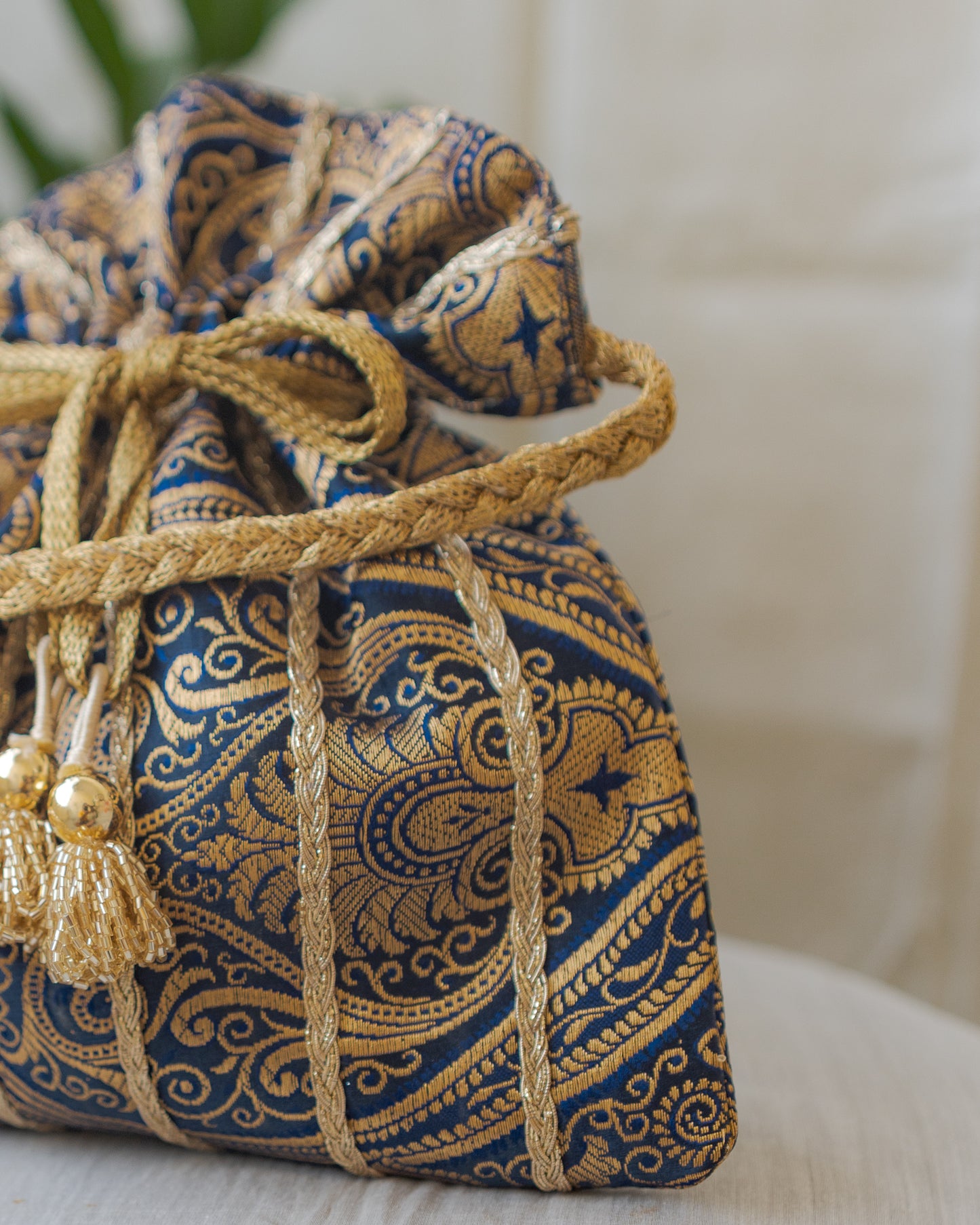Navy Blue & Golden Banarasi Potli With Glass Tassels