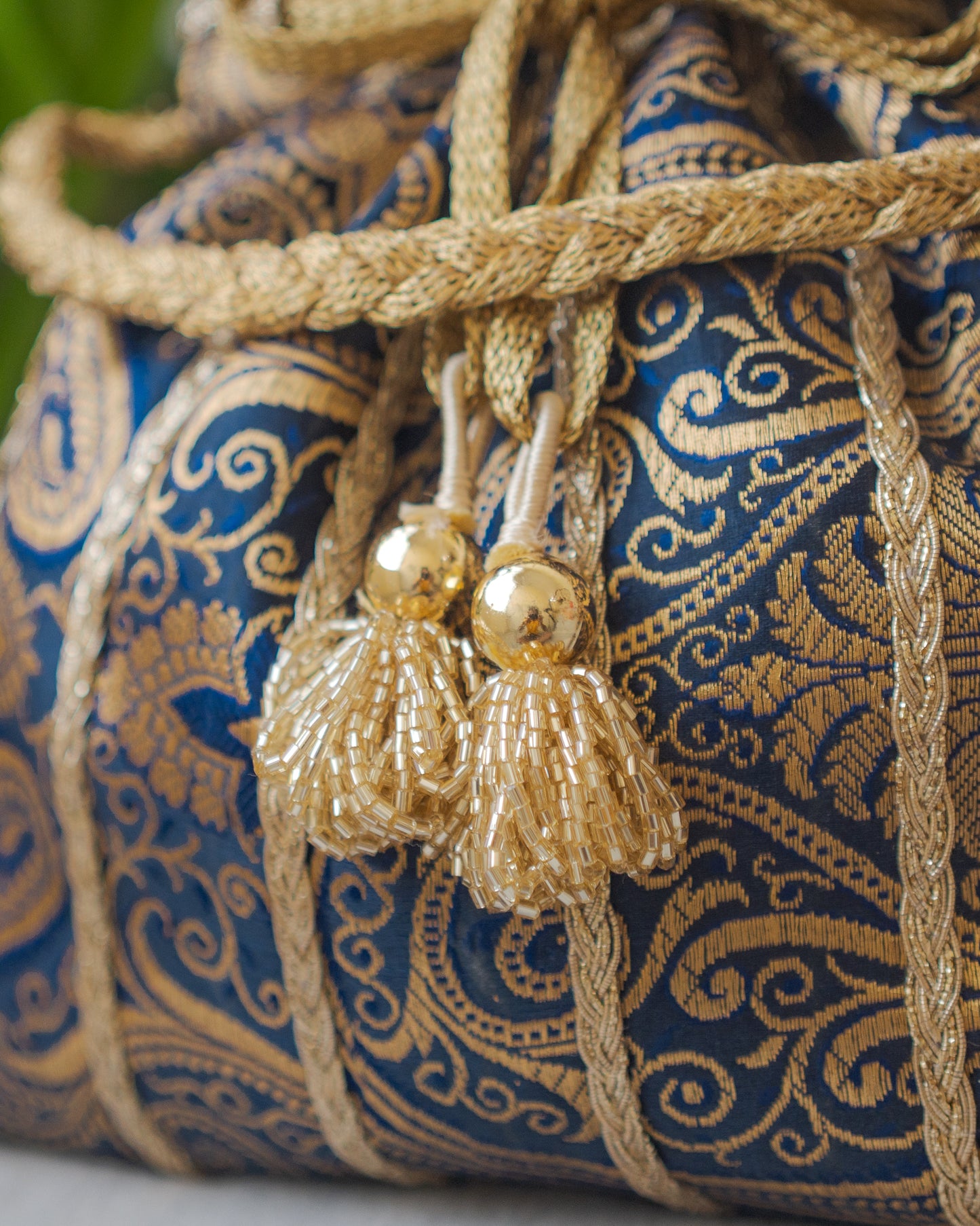 Navy Blue & Golden Banarasi Potli With Glass Tassels