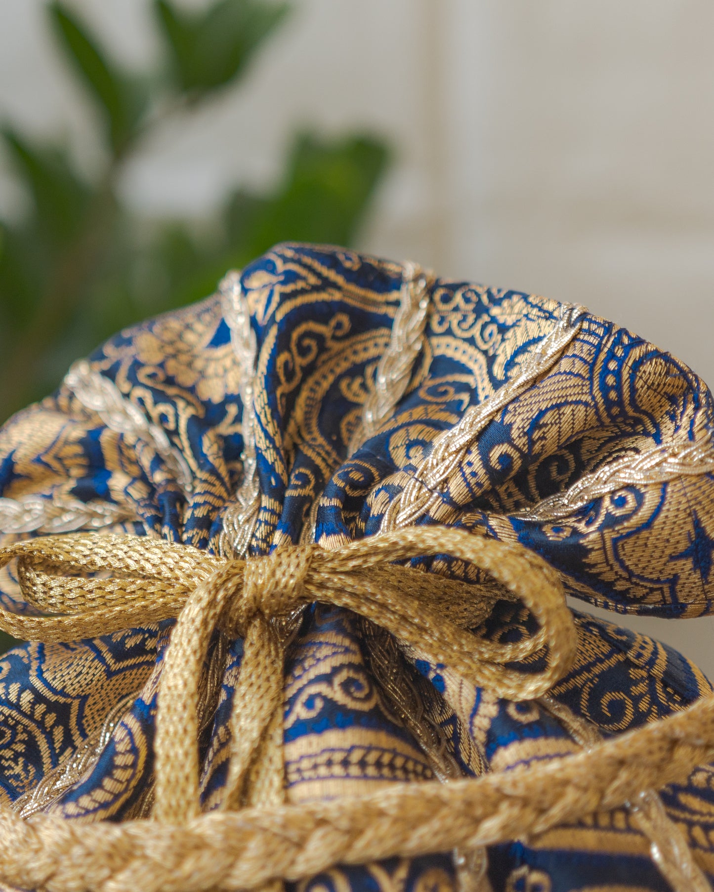 Navy Blue & Golden Banarasi Potli With Glass Tassels