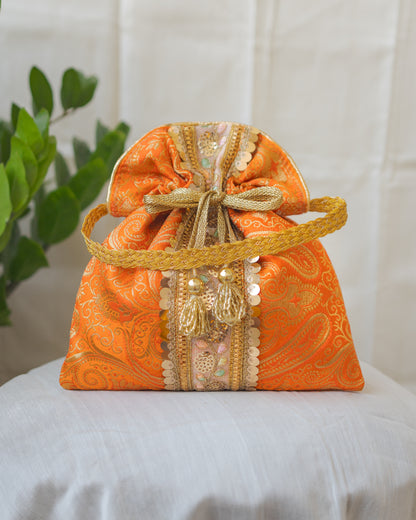 Pumpkin Orange & Golden Banarasi Potli Bag With Broad Lace