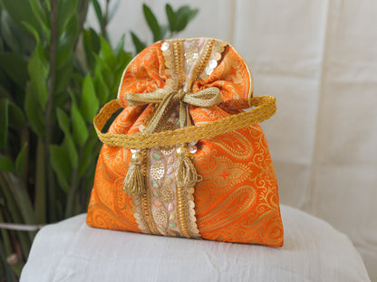 Pumpkin Orange & Golden Banarasi Potli Bag With Broad Lace