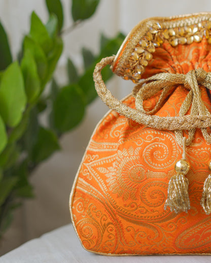 Pumpkin Orange & Golden Banarasi Potli With Glass Tassels