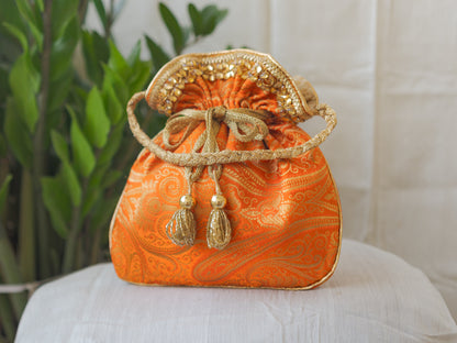 Pumpkin Orange & Golden Banarasi Potli With Glass Tassels