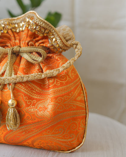 Pumpkin Orange & Golden Banarasi Potli With Glass Tassels