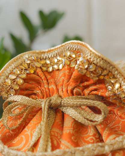 Pumpkin Orange & Golden Banarasi Potli With Glass Tassels