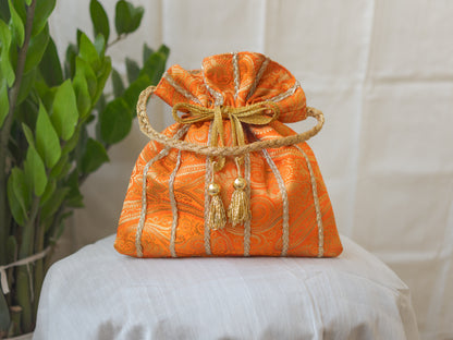 Pumpkin Orange & Golden Banarasi Potli With Glass Tassels