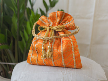 Pumpkin Orange & Golden Banarasi Potli With Glass Tassels