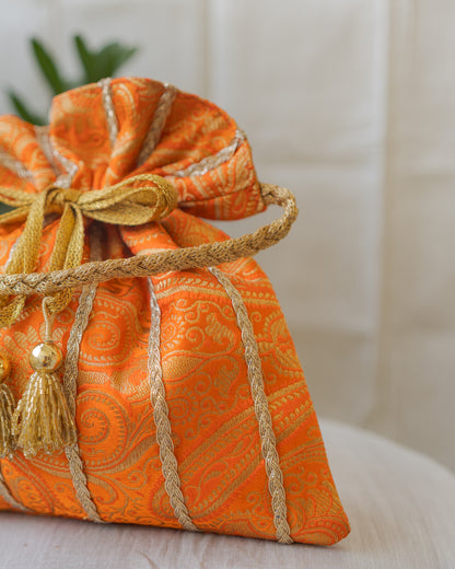 Pumpkin Orange & Golden Banarasi Potli With Glass Tassels