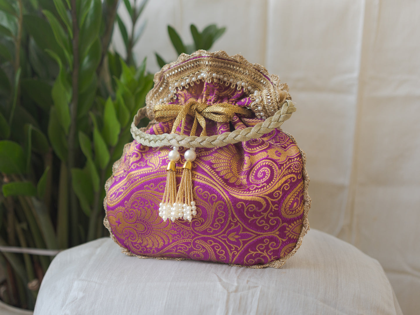 Purple & Golden Banarasi Potli With Pearl Tassels