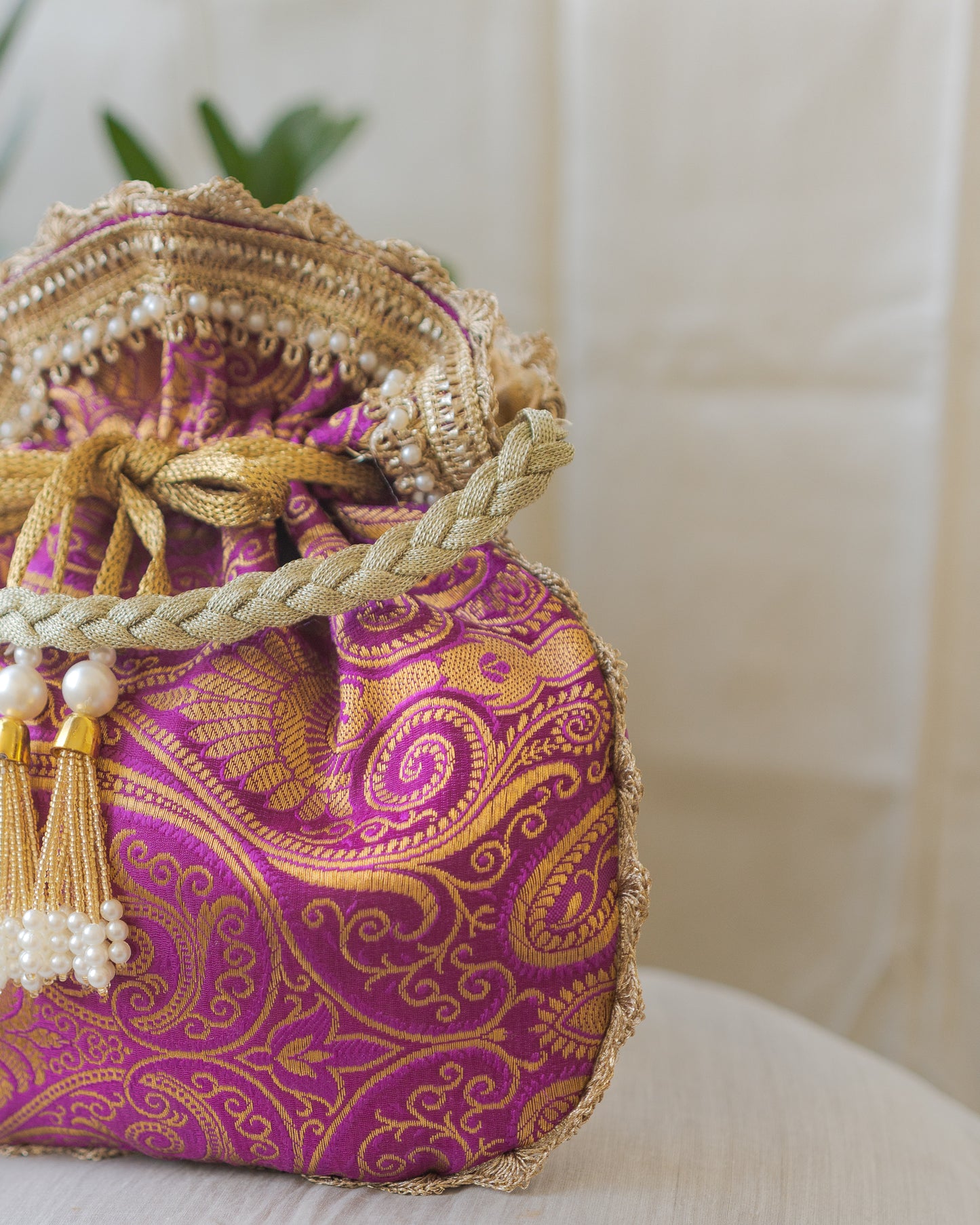 Purple & Golden Banarasi Potli With Pearl Tassels